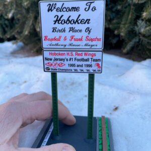 Welcome to Hoboken sign featuring the high school Red Wings